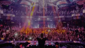 DJ performing for a large crowd inside a Las Vegas nightclub