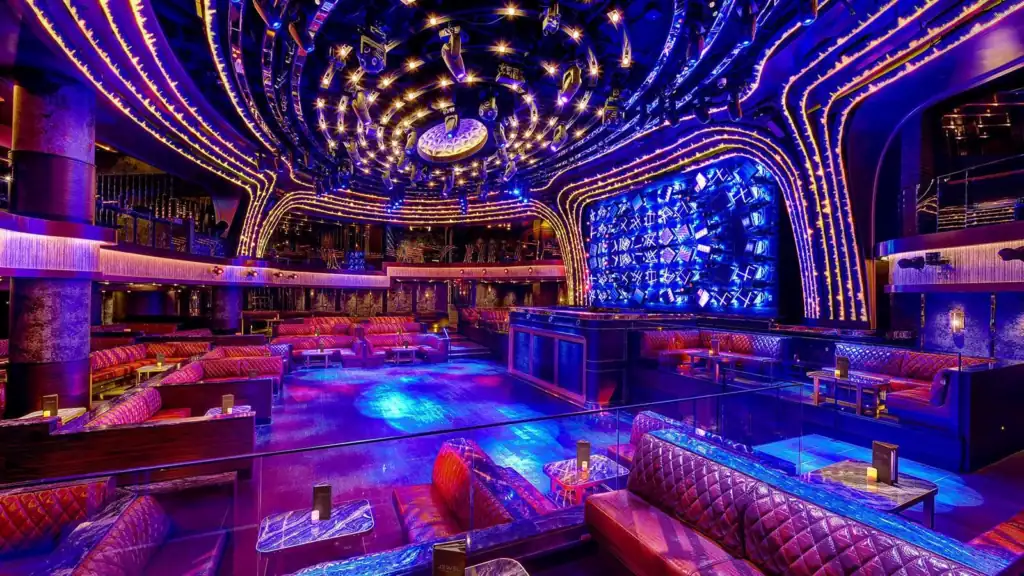 Jewel Nightclub main room inside ARIA Resort and Casino with the DJ booth, LED production wall, dance floor, and tiered VIP seating.