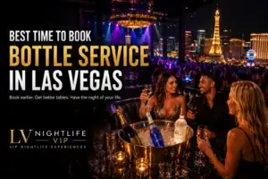 Guests seated at a Las Vegas nightclub VIP table with the Las Vegas Strip visible in the background