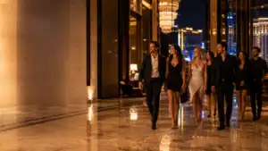 Group of friends dressed for Las Vegas nightlife walking through an upscale resort before going out