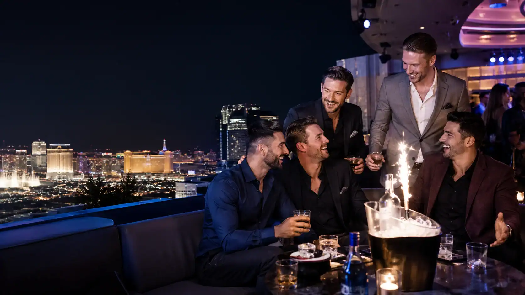 Five friends celebrating a Las Vegas bachelor party at an upscale rooftop lounge overlooking the Strip